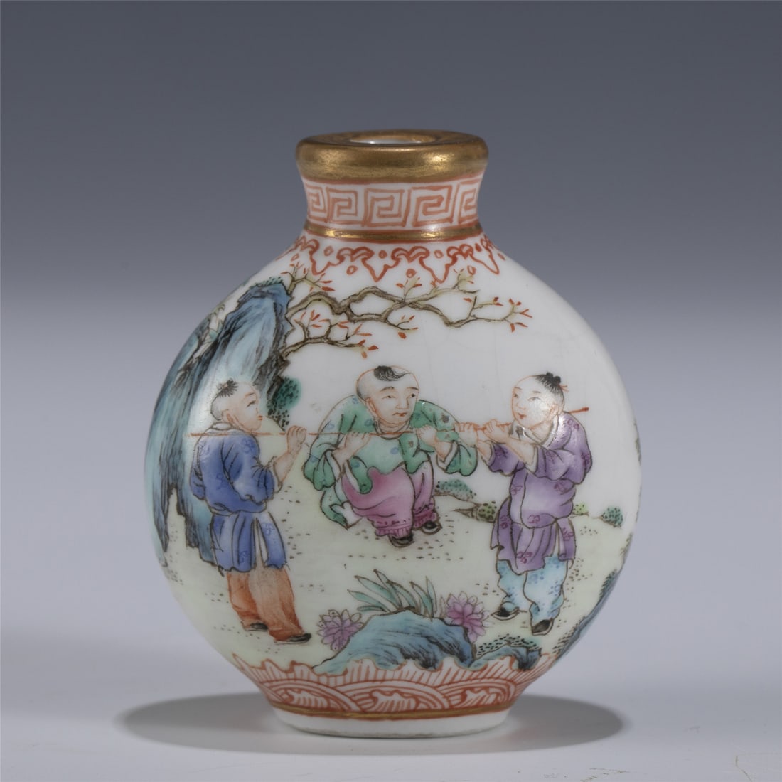 QIANLONG FAMILLE ROSE SNUFF BOTTLE: Measurements: Length: 5cm, Width: 3.2cm, Height: 6cm Chinese Qing Dynasty QianLong Famille Rose Child Porcelain Snuff Bottle. Potted in snuff bottle, sturdily in bulbous lower body, thick potted, deep