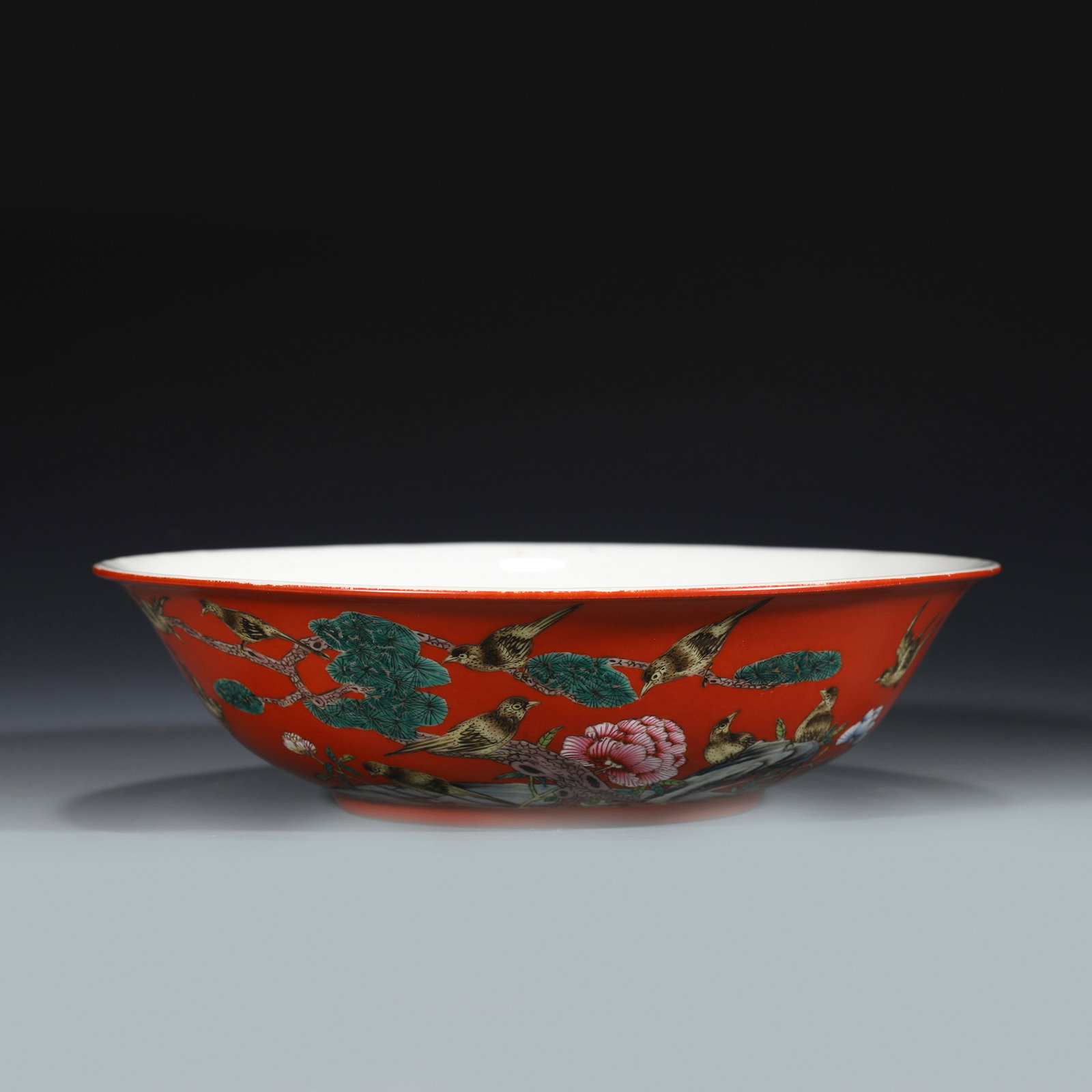 QING GUANGXU FAMILLE ROSE RED BOWL: Dimensions: Width: 20.8cm, Height: 5.5cm Chinese Qing Dynasty GuangXu Magpie Famille Rose Porcelain Bowl. The porcelain potted with a shallow body, slight deep, thick, flaring rim with angled cavetto 