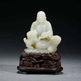EXQUISITE JADE - CARVED ARHAT STATUE WITH LION AND WOOD BASE
