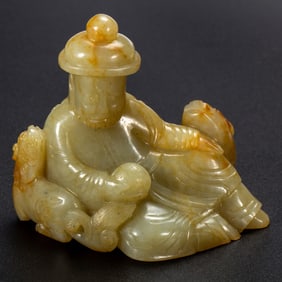 A JADE - CARVED FIGURE