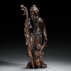 WOODEN SCULPTURE OF THE GOD OF LONGEVITY AND A BOY