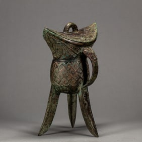 BRONZE JUE WITH DECORATIVE PATTERNS