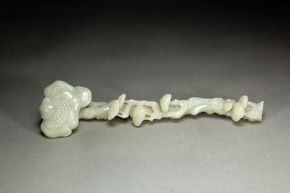 A JADE RUYI WITH EXQUISITE CARVINGS