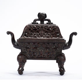 A RED SANDALWOOD INCENSE BURNER WITH EXQUISITE CARVINGS