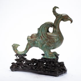 A BRONZE BIRD - SHAPED ZUN