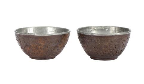A PAIR OF COCONUT - SHELL BOWLS WITH SILVER LININGS