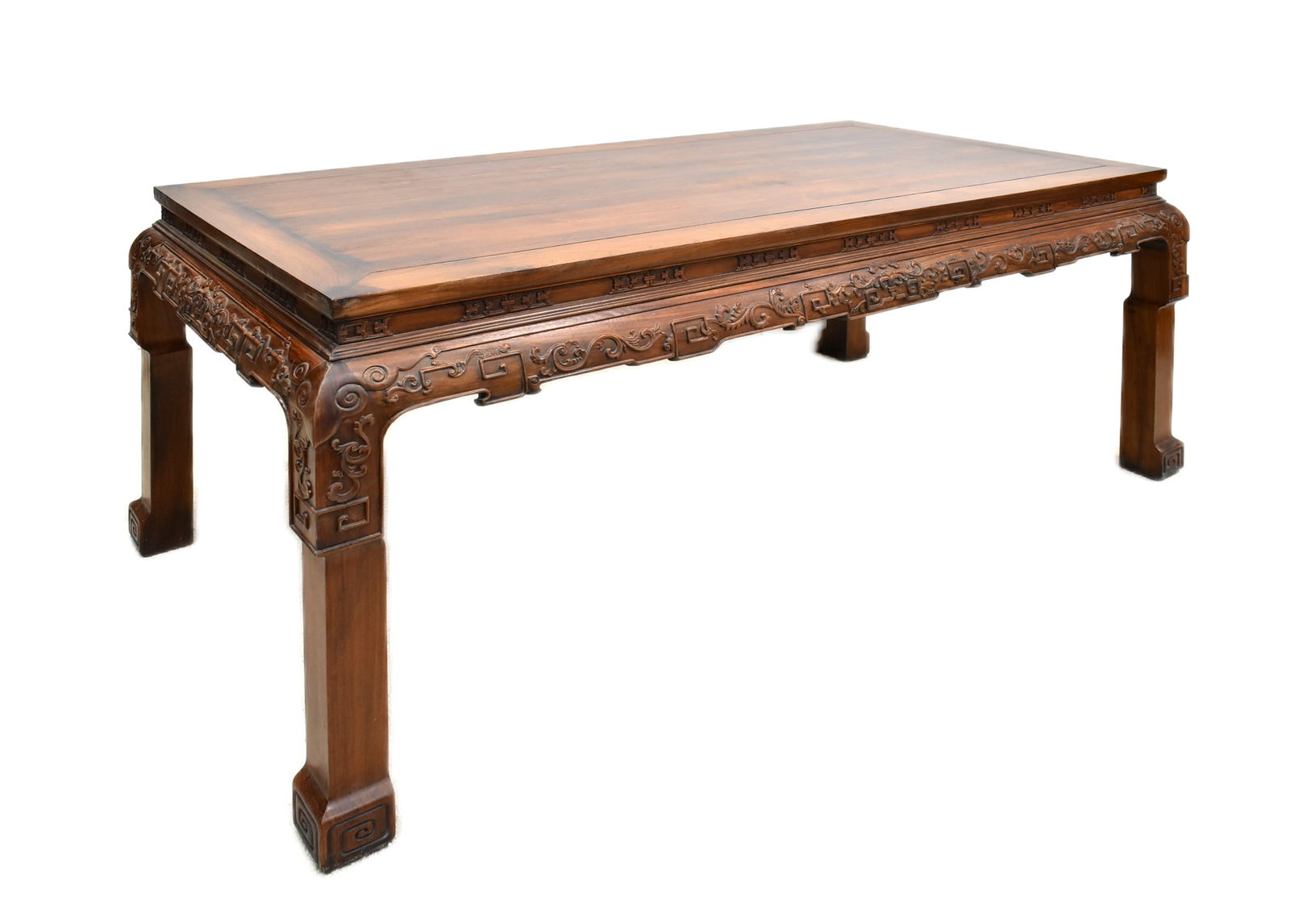 A MASSIVE CARVED HUANGHUALI PAINTING TABLE: Dimension: 32-5/8" H x 73-1/8" W x 35-1/2" DWith panel top set within the wide rectangular frame with beaded, above elaborately carved aprons and spandrels, the whole raised on thick cabriole legs of
