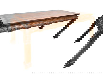 A MASSIVE CARVED HUANGHUALI PAINTING TABLE: Dimension: 32-5/8" H x 73-1/8" W x 35-1/2" DWith panel top set within the wide rectangular frame with beaded, above elaborately carved aprons and spandrels, the whole raised on thick cabriole legs of