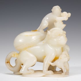 JADE CARVING OF MYTHICAL BEAST AND MONKEYS