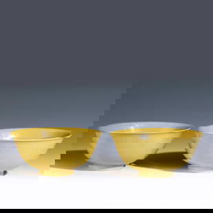 A PAIR OF GUANGXU YELLOW GLAZED BOWLS: Measurements: Width: 15cm, Height: 7cm Pair of Chinese Qing Dynasty Guangxu Yellow Glazed Porcelain Bowls. The porcelain potted with a shallow body, slight deep, thick, flaring rim with angled cavetto