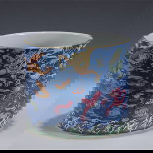 QIANLONG FAMILLE ROSE DRAGON BRUSH POT: Measurements: Length: 20.5cm, Width: 20.5cm, Height: 17.4cm Chinese Qing Dynasty Qianlong Famille Rose Dragon Porcelain Brush Pot. Potted in cylindrical body, thick, gently tapered to straight close r