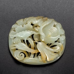 JADE CARVING WITH FLOWER - AND - BIRD PATTERNS