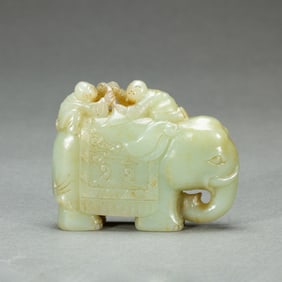 JADE CARVING OF BOYS PLAYING WITH AN ELEPHANT