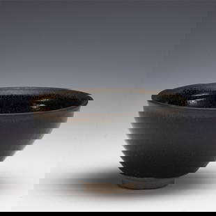 SONG JIAN WARE TEA BOWL: Measurements: Length: 12.5 cm, Height: 7 cm Chinese Song Dynasty Jian Ware Tea Bowl. Potted with a shallow body, slight deep, thick and bulbous body, with angled cavetto elevated the steep sides upwar
