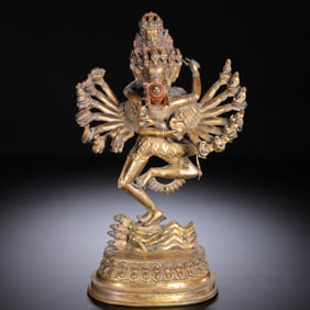 GILT BRONZE STATUE OF A MULTI - ARMED DEITY