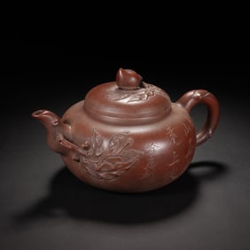 CHINESE YIXING ZISHA TEAPOT WITH PEACH MOTIF AND INSCRIPTIONS
