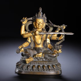 GILT - BRONZE STATUE OF A MULTI - ARMED BUDDHIST DEITY