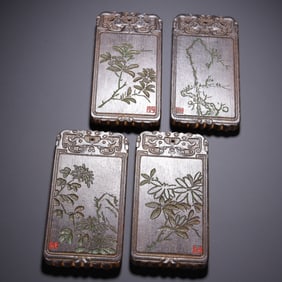 SET OF FOUR WOODEN CARVED PLAQUES WITH PLANT PATTERNS