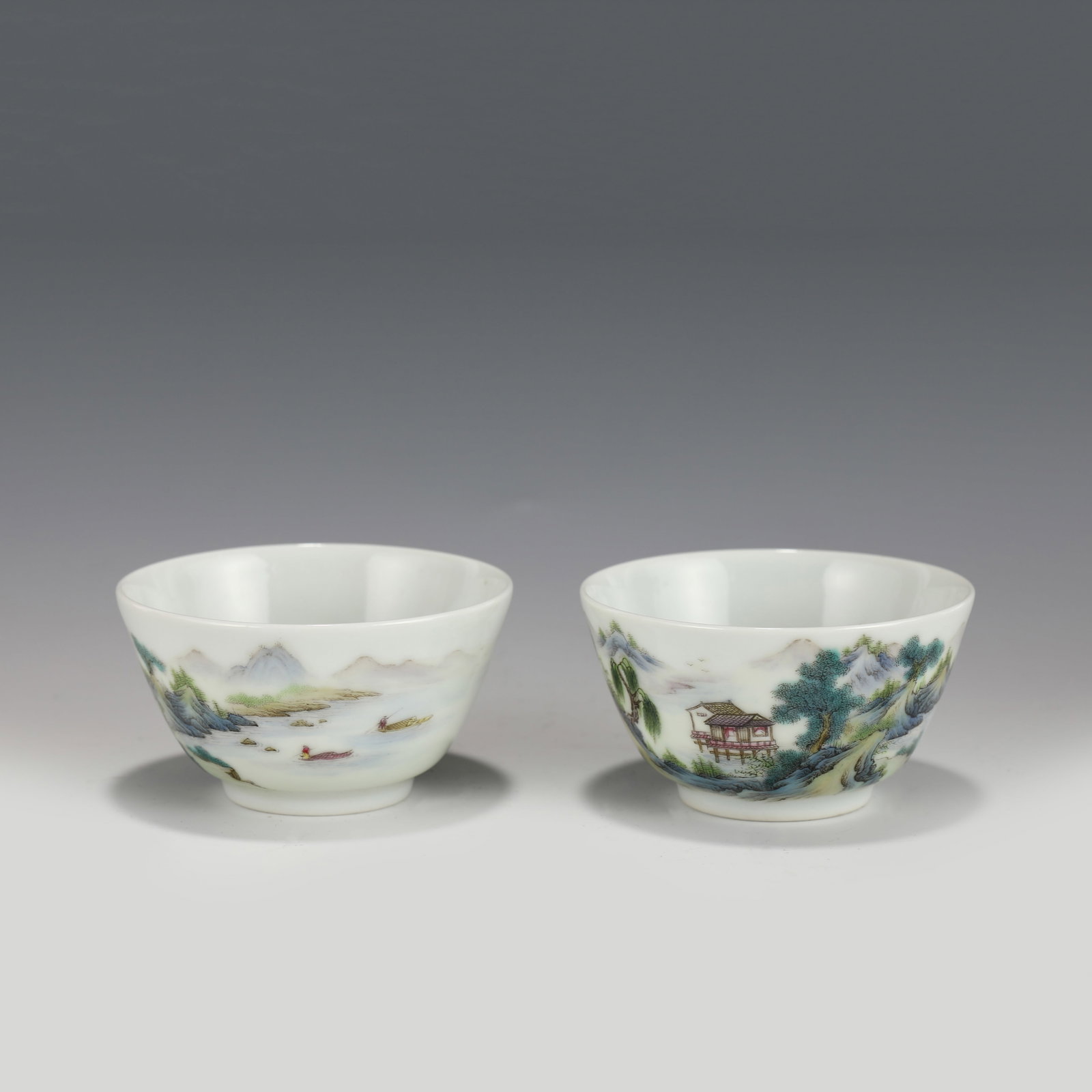 PAIR OF QIANLONG FAMILLE ROSE BOWLS: Dimensions (cm): Height: 4.7cmcm, Diam.: 8.3 Pair Of Chinese Qing Dynasty QianLong Famille Rose Mountain Porcelain Bowls. The bowls has an open mouth, rounded lip rim, thick, deep arced body, raised w