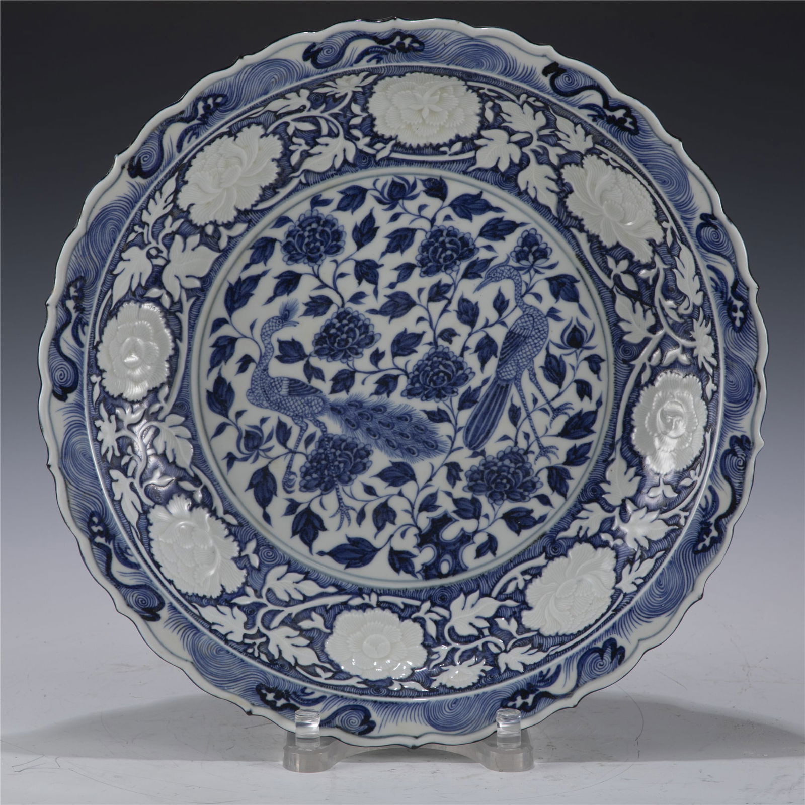 YUAN BLUE AND WHITE PLATE: Dimensions: Length: 44. 8 cm, Width: 44. 8 cm, Height: 8 cm Chinese Yuan Dynasty Blue and White Peacock Porcelain Plate. The plate has a broad wide central interior, rounded flori mouth lip, thick and
