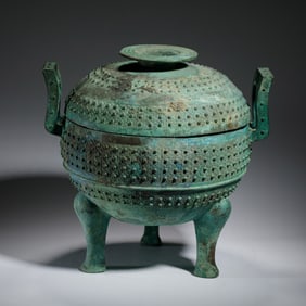 BRONZE DING WITH INTRICATE DECORATIVE PATTERNS