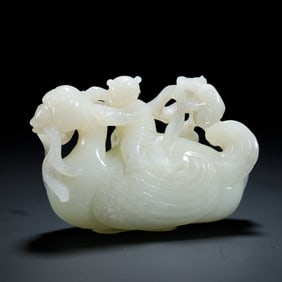 WHITE JADE CARVING OF A CHILD RIDING A MYTHICAL BIRD - LIKE CREATURE