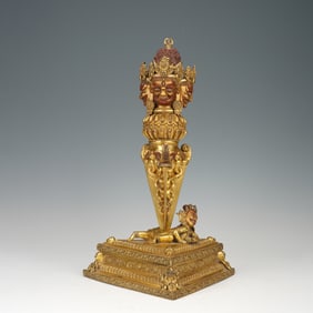 GILDED BRONZE RITUAL IMPLEMENT WITH ORNATE CARVINGS AND FIGURES