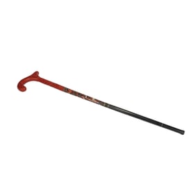 DECORATIVE CANE WITH INTRICATELY CARVED RED HANDLE AND PATTERNED SHAFT