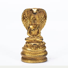 GILT - BRONZE STATUE OF BUDDHA SHELTERED BY A NAGA