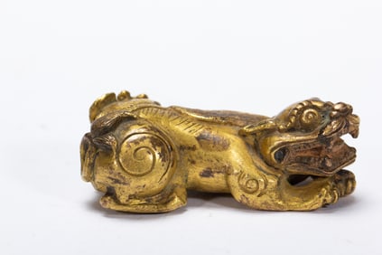 GILT - BRONZE SCULPTURE OF AN AUSPICIOUS MYTHICAL BEAST