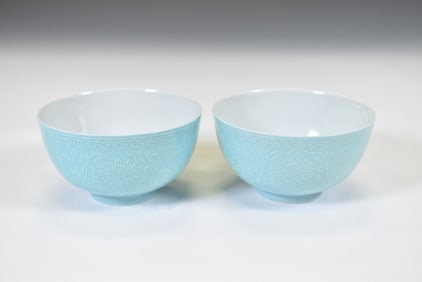 A FINE PAIR OF TURQUOISE-GROUND CARVED PORCELAIN BOWLS