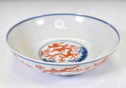 A FINE WUCAI DRAGON AND WAVES BOWL