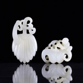 PAIR OF CARVED WHITE JADE PENDANTS