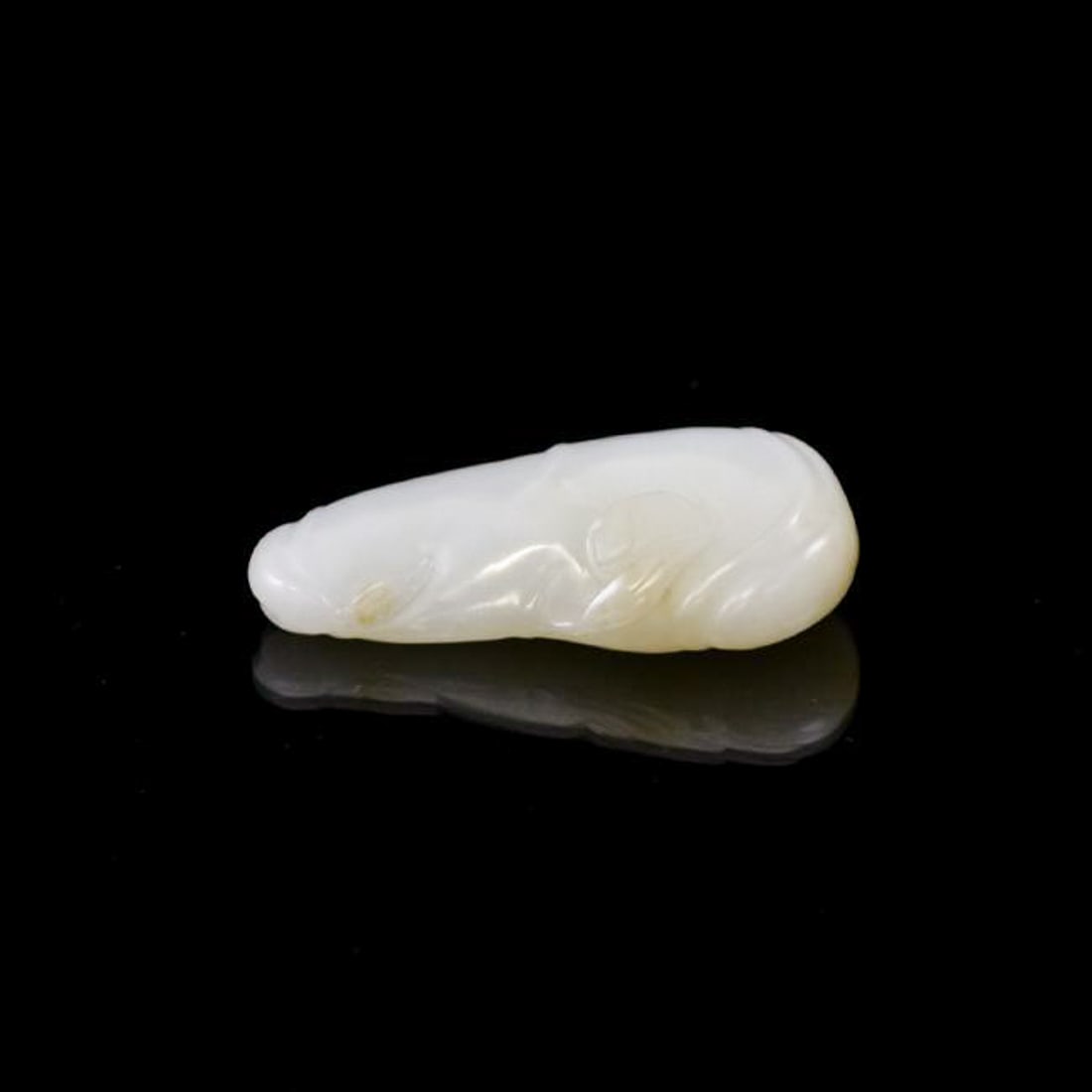 CHINESE JADE GOURD PENDANT: Dimensions: 73.16mm H x 30.51mm W Weight: 62.7g Chinese celadon jade pendant in shape of a gourd and its branching stem foliate. The jade shows celadon color, with clean translucent, finely polished.