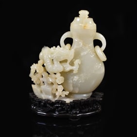 A SUPERB FINELY CARVED WHITE JADE DOUBLE HANDLED VASE