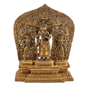 EXCEPTIONAL TIBETAN GILT BRONZE TRIAD WITH ELABORATE MANDORLA