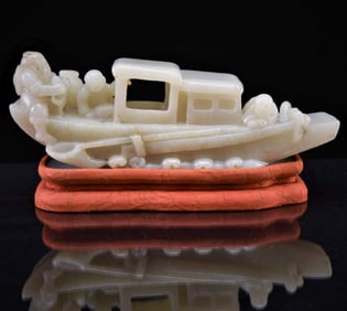 FINELY CARVED WHITE JADE RECUMBENT BOAT, 19TH C