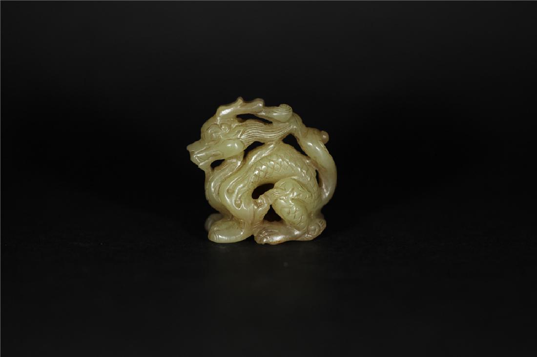 A YELLOW JADE CARVED DRAGON          YUAN DYNASTY (1 of 7)