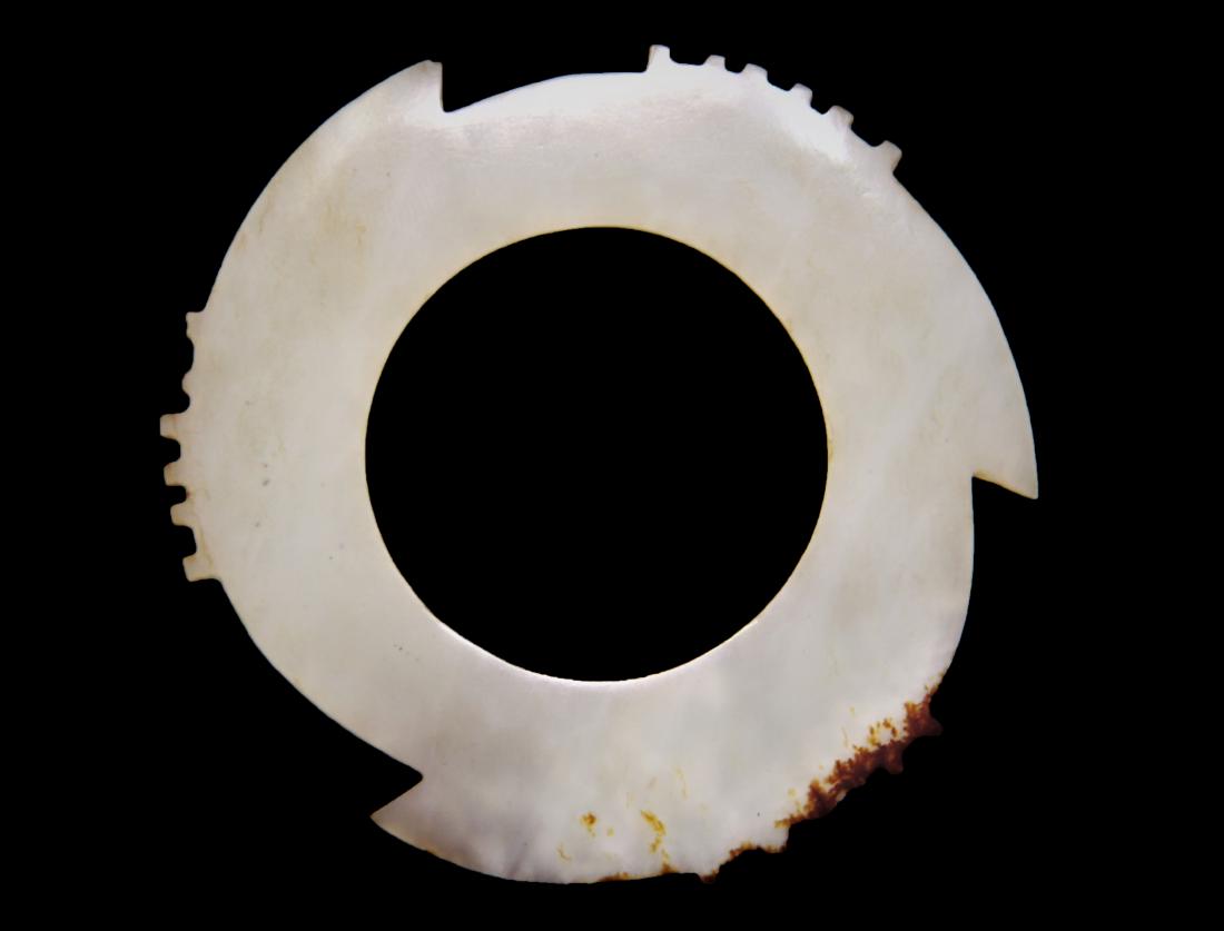 WESTERN ZHOU DYNASTY PERIOD, JADE CARVED 'XUAN'DISC: H:2 15/16in(7.4cm)