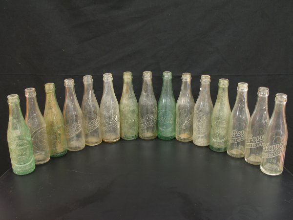 COLLECTIBLE DR PEPPER EMBOSSED SODA POP BOTTLES: Circa 1940s, Lot of 15, Various sizes and labels, Please see photos