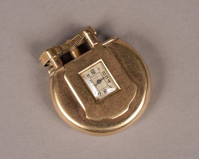 Rare Dunhill 9K Gold Lighter & Watch: A Rare Dunhill 9K Gold Lighter and Watch Dimensions: H: 2" W: 1 7/8" D: 3/8" Having a unique shape we have yet to sell, From an Austin,Texas Estate