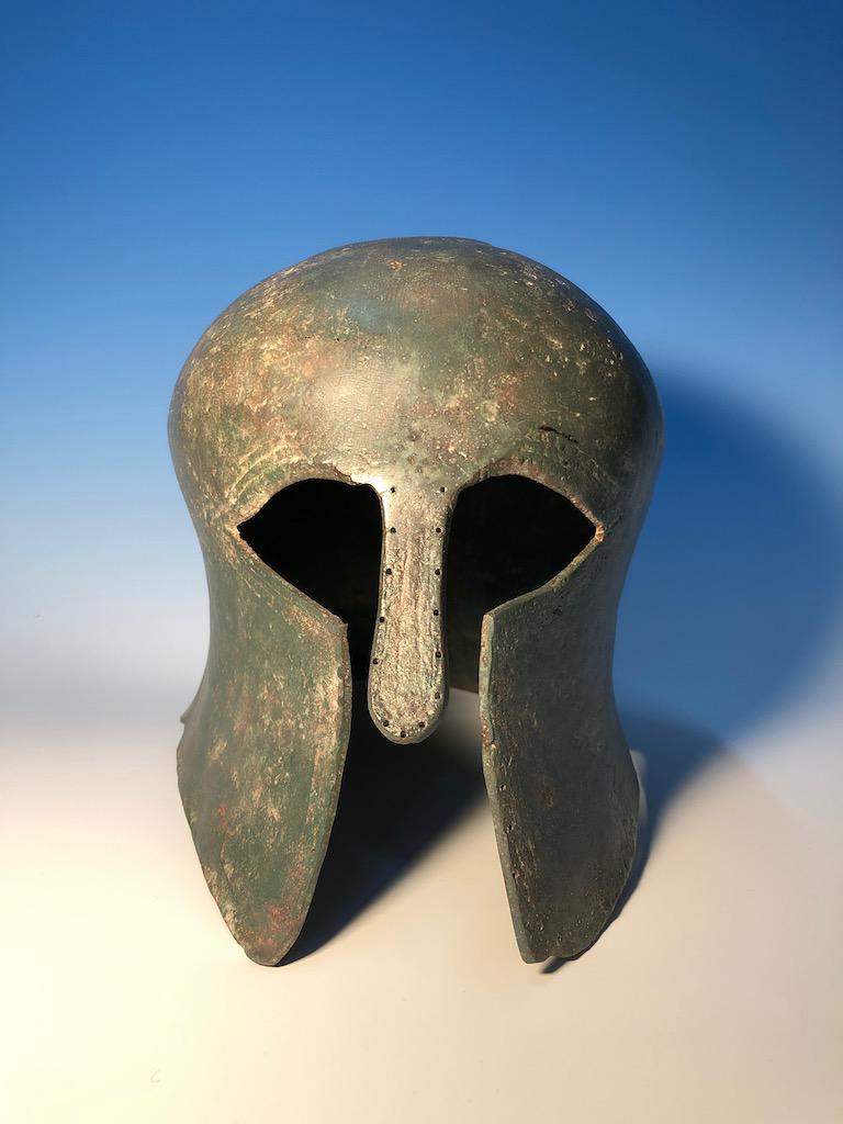 Greek Bronze Corinthian Style Helmet: Greek Bronze Corinthian Style Helmet, Dimensions: Height: 8" Depth: 11" Width: 7.5", Provenance: From a Southern Califnora Estate