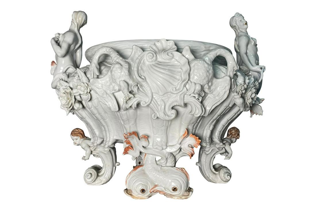 A Meissen Porcelain Blanc De Chine Centerpiece: A Meissen Porcelain Blanc De Chine Centerpiece, marked on bottom with crossed swords mark, Height: 13" Width: 16" Depth: 13"