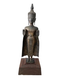 A LARGE HEAVILY CAST COPPER/ALLOY STANDING BUDDHA, EARLY 19TH CENTURY OR EARLIER