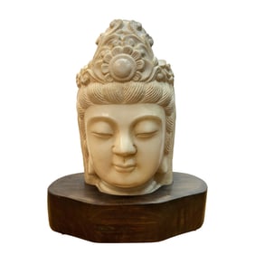 A CHINESE CARVED MARBLE BUDDDHA HEAD