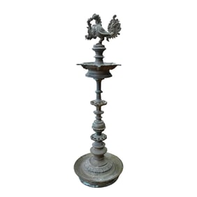 AN ANGLO INDIAN STANDING FIGURE WITH BIRD