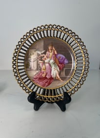 A ROYAL VIENNA RETICULATED PORCELAIN PAINTED PLATE, CIRCA 1920