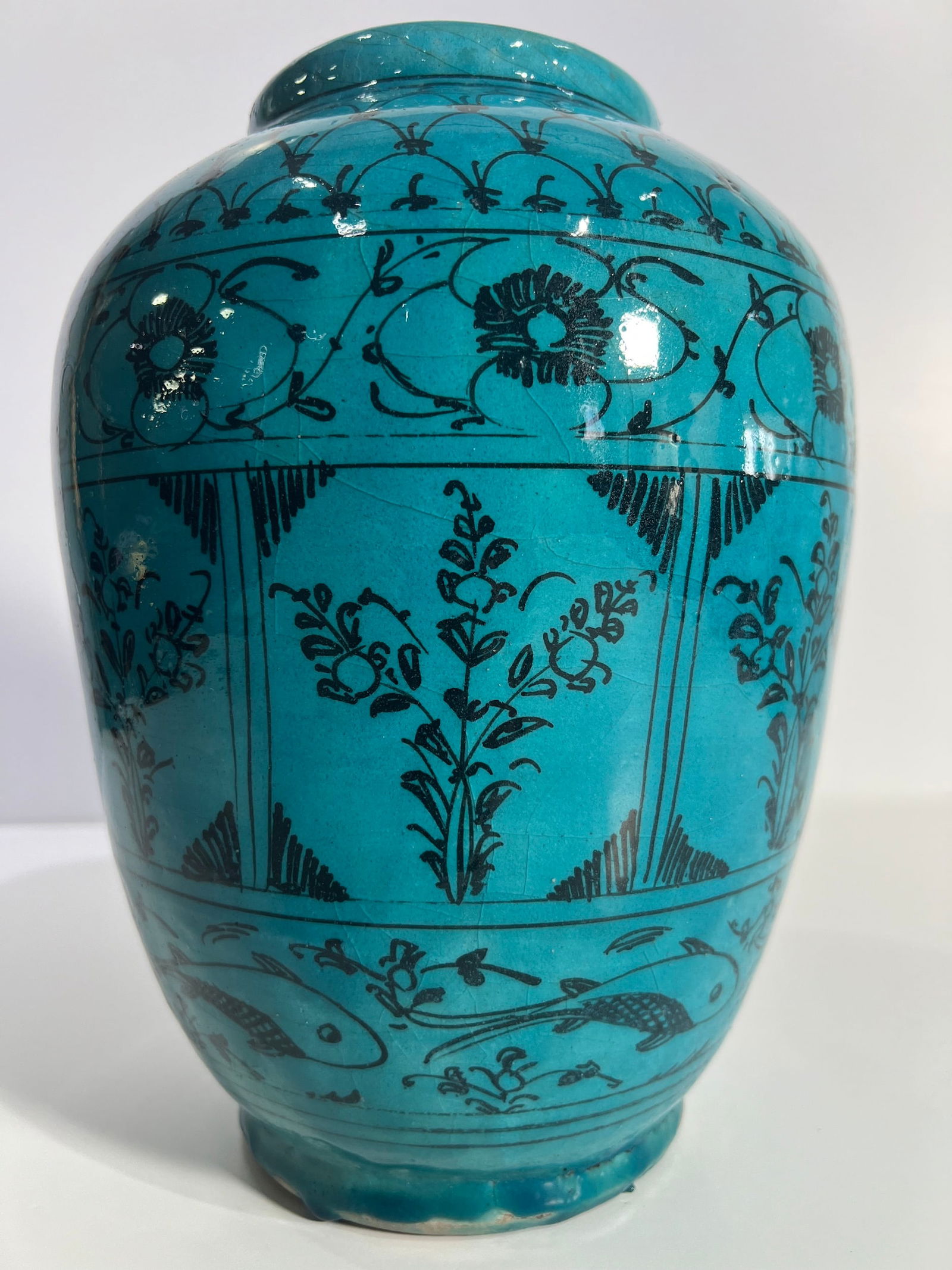 A PERSIAN TURQUOISE GLAZED CERAMIC VASE (1 of 6)