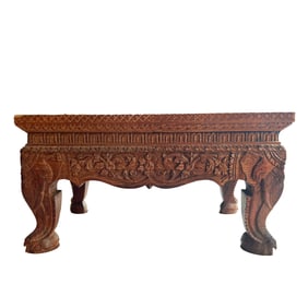 AN ANGLO INDIAN CARVED ELEPHANT DECORATED PEDESTAL