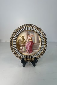 A ROYAL VIENNA STYLE RETICULATED PORCELAIN PAINTED PLATE, CIRCA 1920